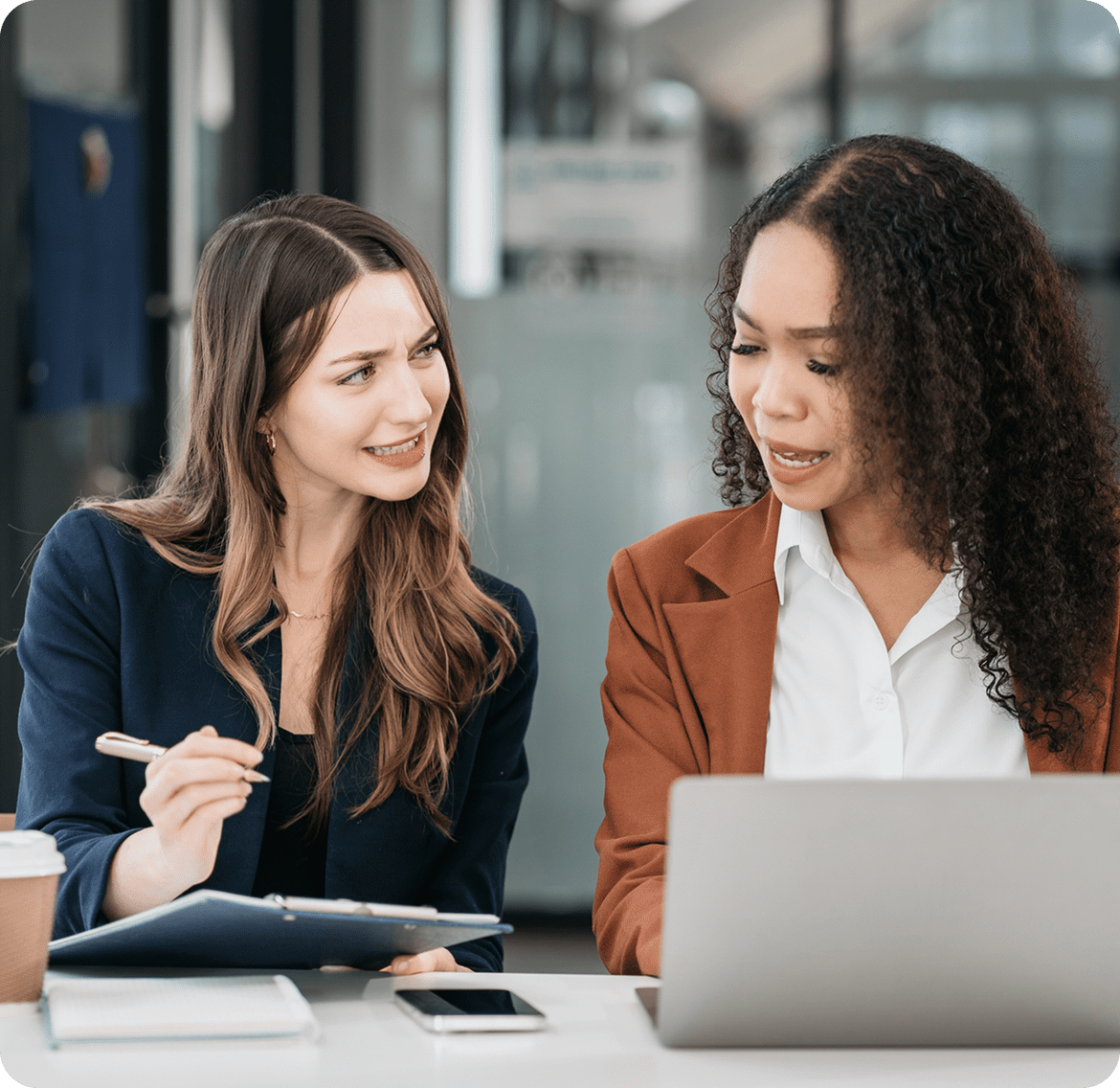 Women in meeting with documents