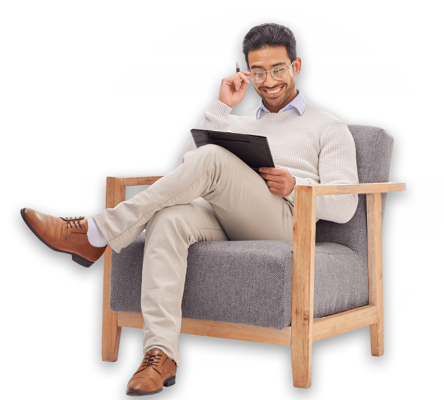 Man in chair holding tablet