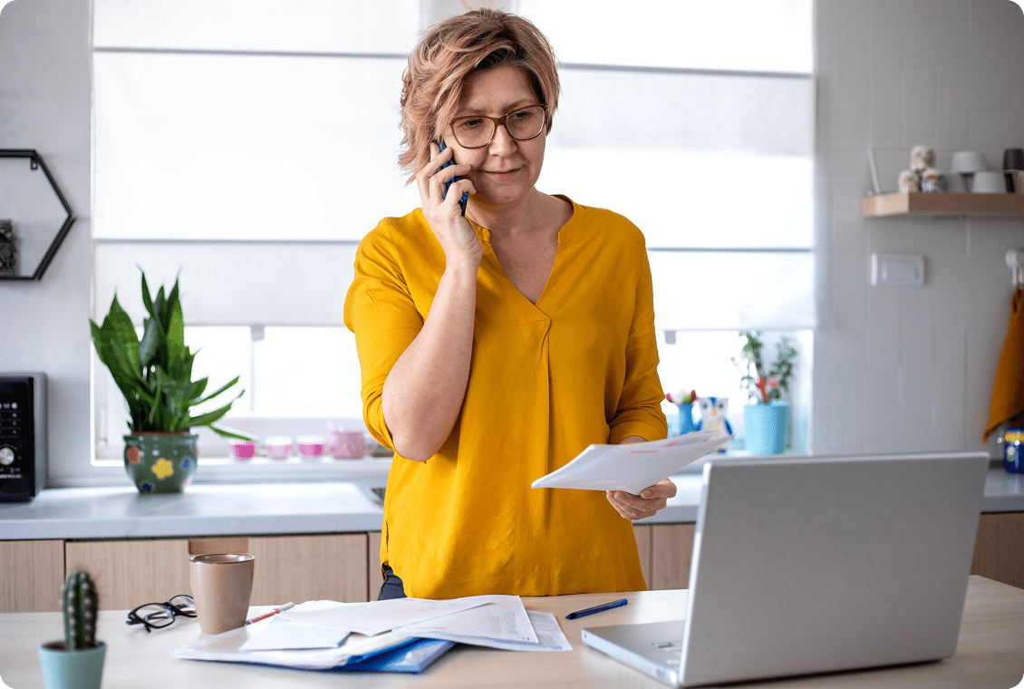 Woman on phone working at home