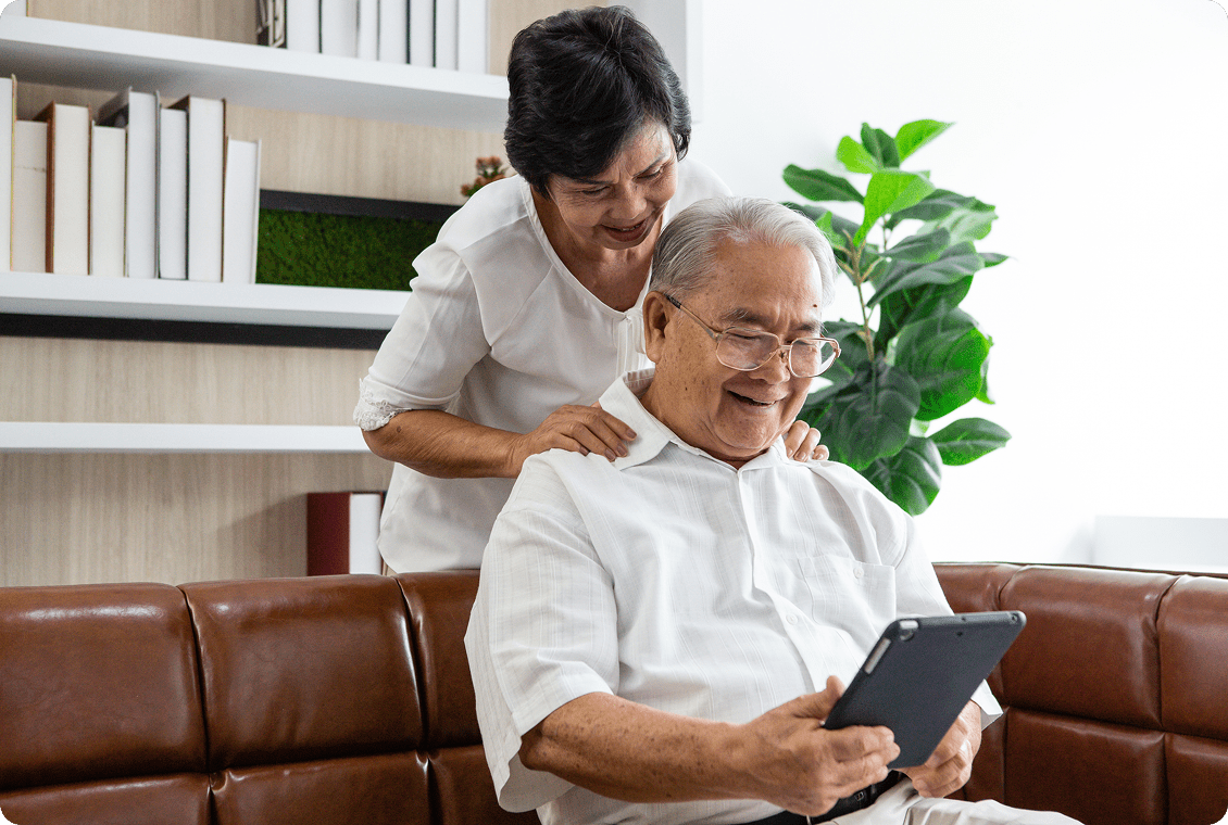 Elderly couple using a tablet together